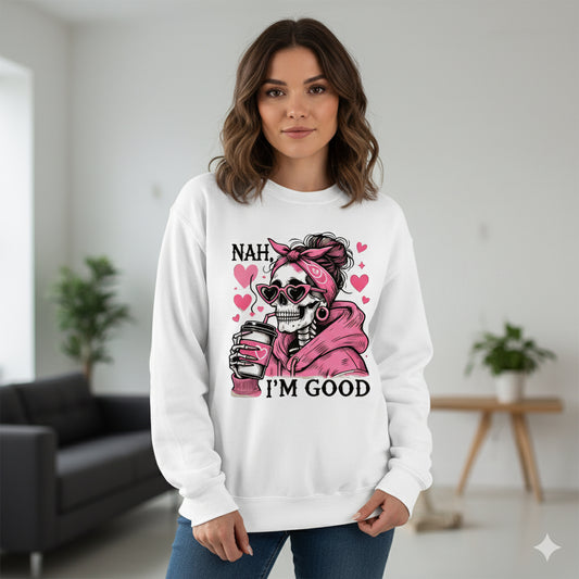 Woman wearing a white sweatshirt with a graphic design and text in a room.