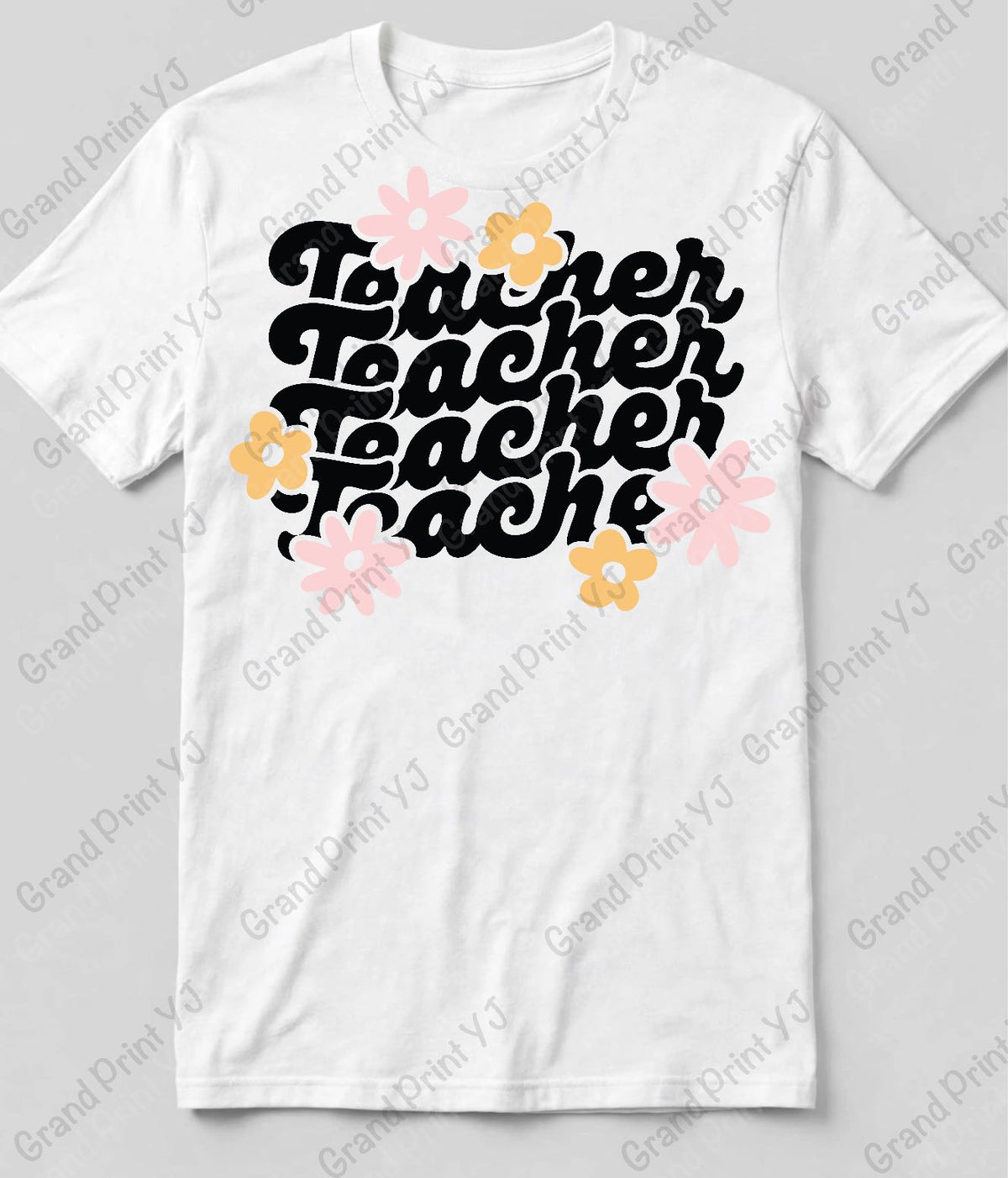 A white short-sleeve crewneck t-shirt featuring a retro-style graphic that reads 'Teacher Teacher Teacher' in black cursive script, decorated with pink and yellow flowers, shown on a light gray background with a diagonal Grand Print YJ watermark.
