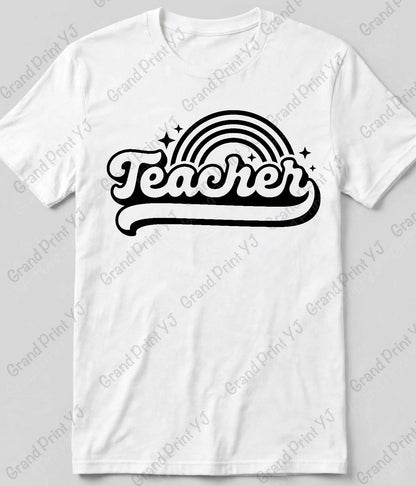 A white short-sleeve crewneck t-shirt featuring a retro-style black graphic on the chest with the word 'Teacher' in a wavy font beneath a curved rainbow and stars.
