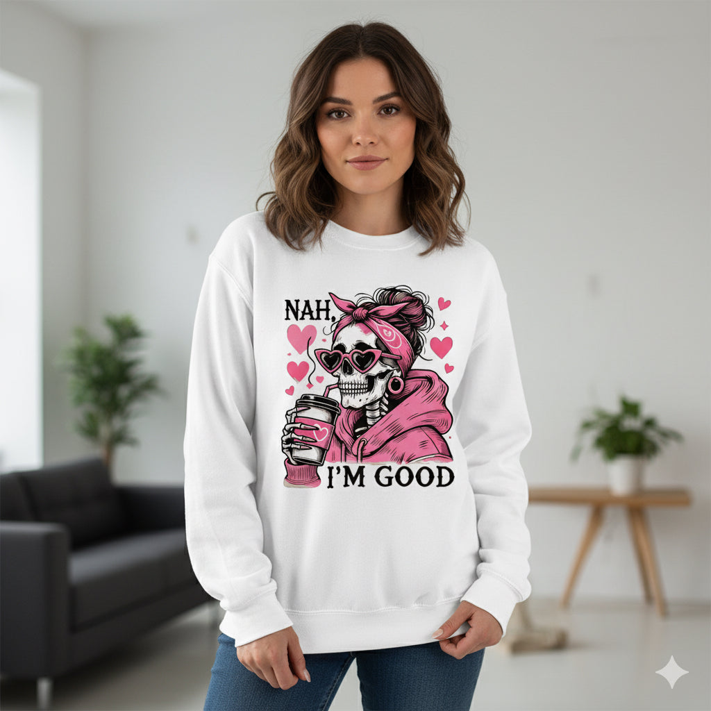 Woman wearing a white sweatshirt with a graphic design and text in a room.