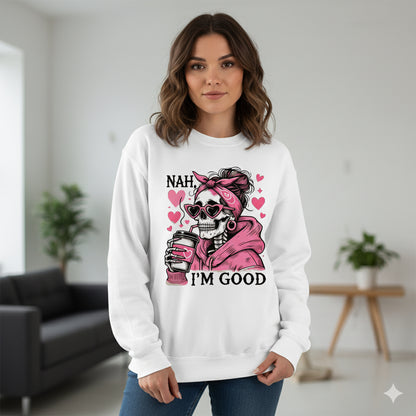 Woman wearing a white sweatshirt with a graphic design and text in a room.