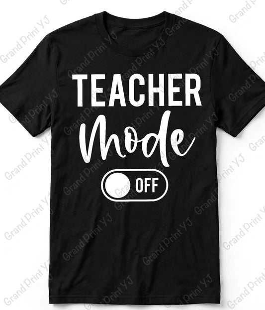 A black short-sleeve t-shirt with a white graphic print that reads 'TEACHER Mode OFF' with a toggle switch design, shown on a white background with diagonal Grand Print Yd watermarks.