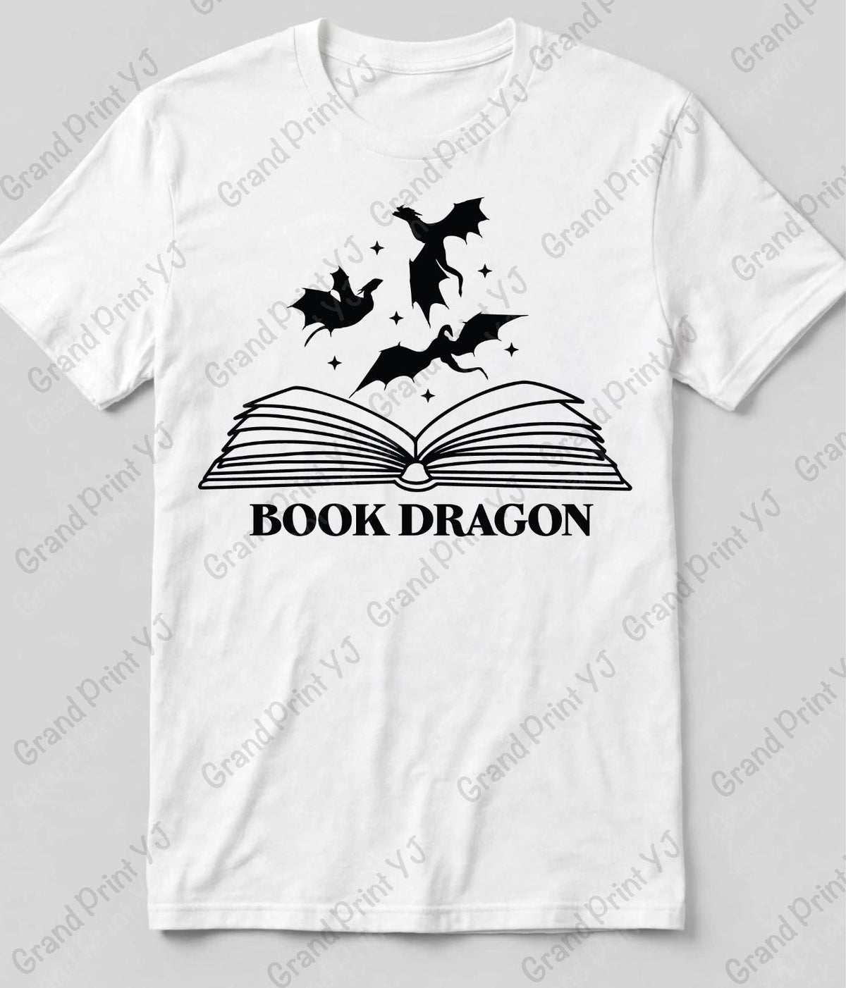 A white short-sleeve crewneck t-shirt with a black graphic print of an open book and three flying dragons above the text 'BOOK DRAGON'.