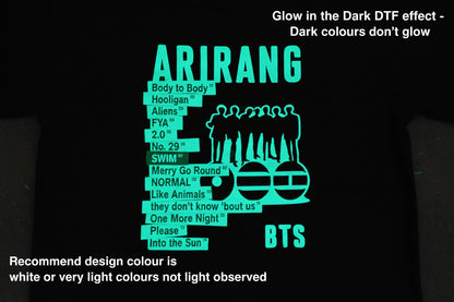 Black shirt with green text and graphics on a black background